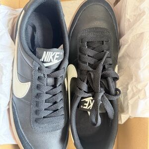 Nike Black Sneakers with Cream Swoosh